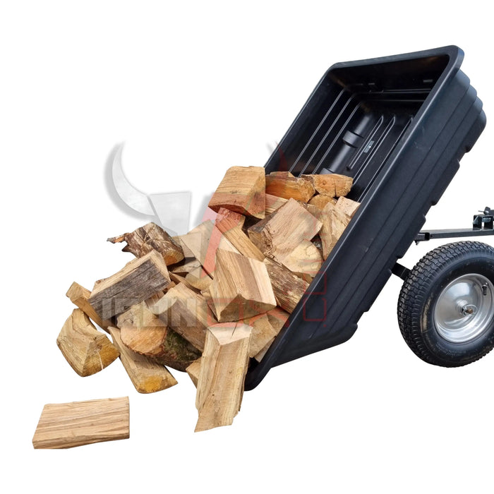 A black Iron Ox Haul 6 - Tipping Trailer 600lb with logs on it.