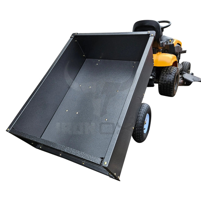 A lawn mower with a trailer attached to it, specifically an Iron Ox® 'MT' - Tipping Trailer 400lb.