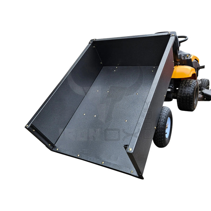 A black tractor with an Iron Ox® 'MT' - Tipping Trailer 400lb on it.