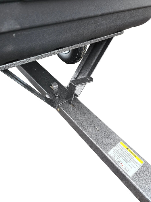 A black Iron Ox® Haul 4 - Tipping Trailer 400lb with a trailer hitch attached to it for hauling.