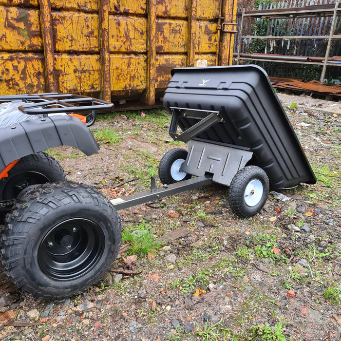 An ATV with an Iron Ox® Haul 4 - Tipping Trailer 400lb attached to it.