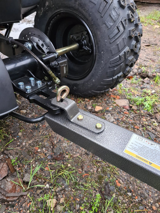 A black Iron Ox® Haul 4 - Tipping Trailer 400lb atv with a trailer attached to it for hauling.
