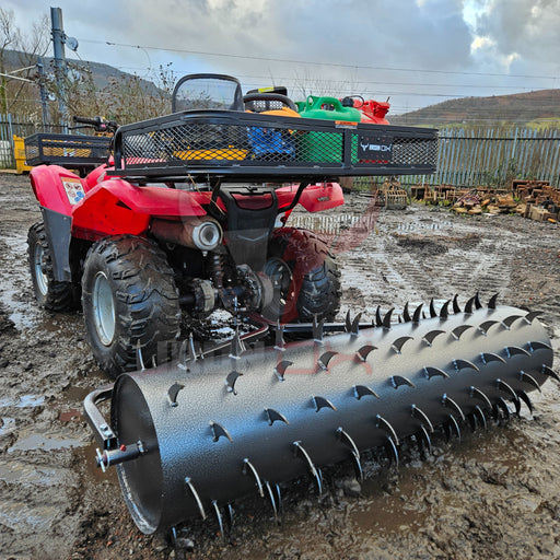 A red Towable Spiked Roller Aerator 60" Wide with a plow attached to it for efficient aeration.
