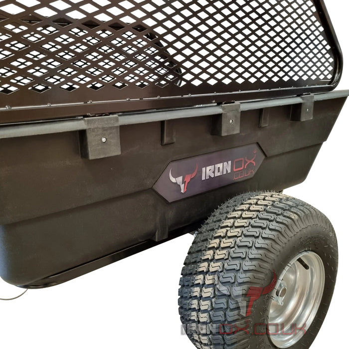 A black Iron Ox® Haul 10 - Tipping Trailer 1500lb with a tire on it.