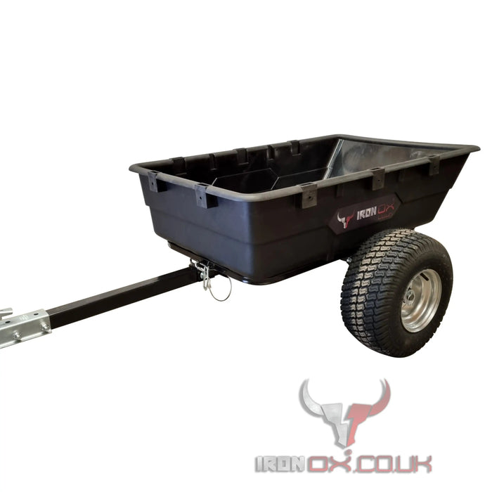 A black Iron Ox® Haul 10 - Tipping Trailer 1500lb with wheels and a bull on it used for Iron Ox Haul 10.