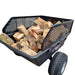 An Iron Ox® Haul 10 - Tipping Trailer 1500lb filled with logs.