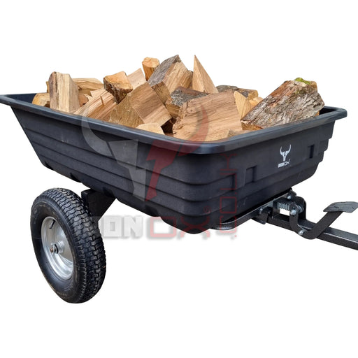 A black Iron Ox Haul 6 - Tipping Trailer 600lb with logs on it.