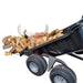 A black ATV Tipping Trailer - Iron Ox Haul 15 - 4 Wheel Trailer with logs in it.