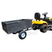 A lawn mower with an Iron Ox® 'MT' - Tipping Trailer 400lb.