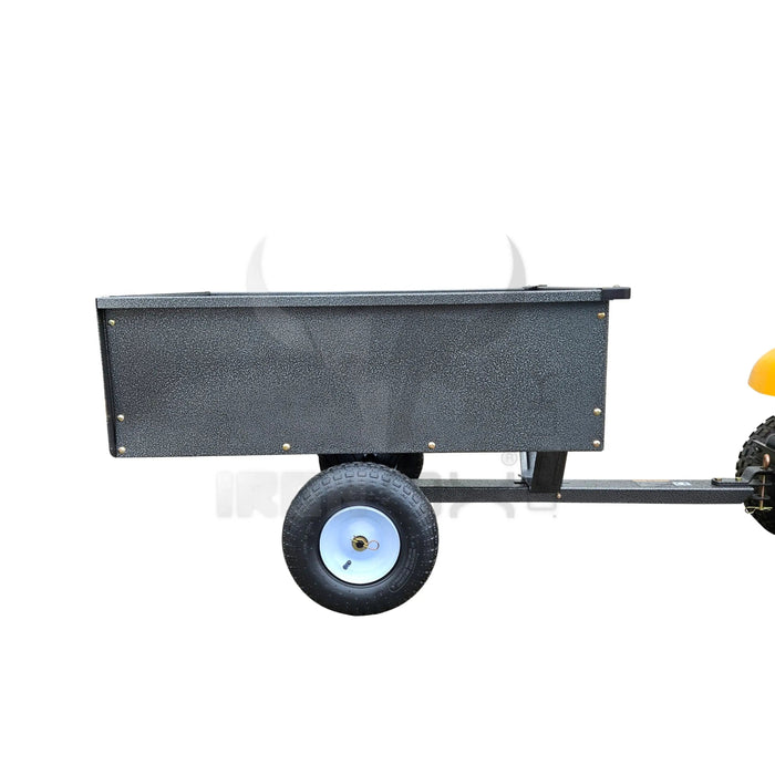 A small black Iron Ox® 'MT' - Tipping Trailer 400lb, also known as a dump cart, with wheels on a white background.