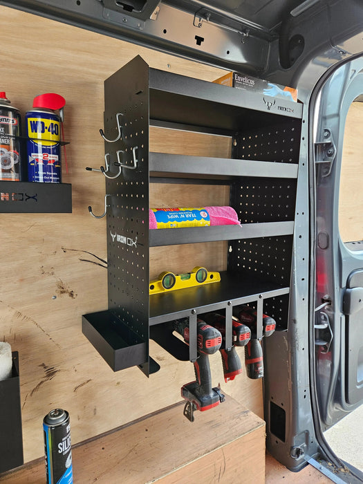 The Van Racking Drill & Accessory Shelf for Garages, Workshop is a wall-mounted solution that optimizes van storage with a drill holder rack and shelves designed for spray cans, a spirit level, and pink cloths. Cordless drills are neatly arranged below, providing superior power tool storage that surpasses typical garage organization standards.