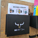 A black File & Paperwork Holder with the "iring xx" logo and a bull's head design, wall-mounted on a wooden surface beside various flyers and advertisements.