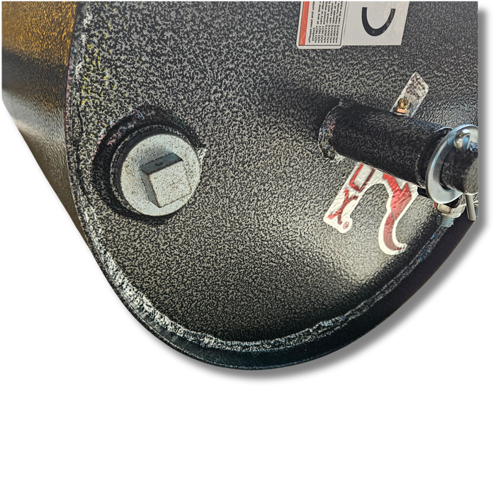 Close-up view of the heavy-duty textured black metal surface of the Lawn Roller 60", featuring a bolt and a protruding cylindrical component with small labels marked in red. The design implies universal hitch compatibility, making it perfect for rugged tasks like lawn care.
