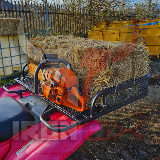 A pink ATV with a ATV Rear Basket Rack Universal Fitment carrying hay.