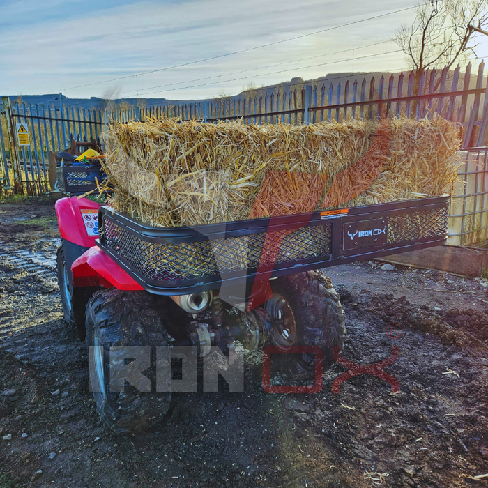 A red ATV with hay in the ATV Rear Basket Rack Universal Fitment.