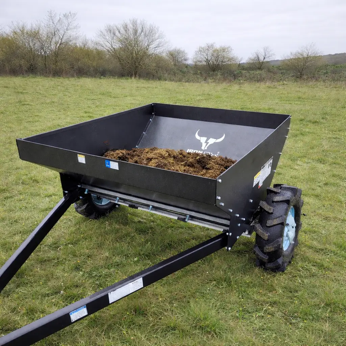 Side view of ATV manure spreader showing steel hopper for quad bikes