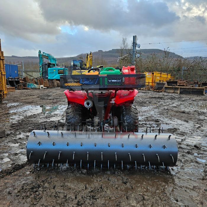 A red Towable Spiked Roller Aerator 60" Wide with a mud plow attached for efficient aeration.