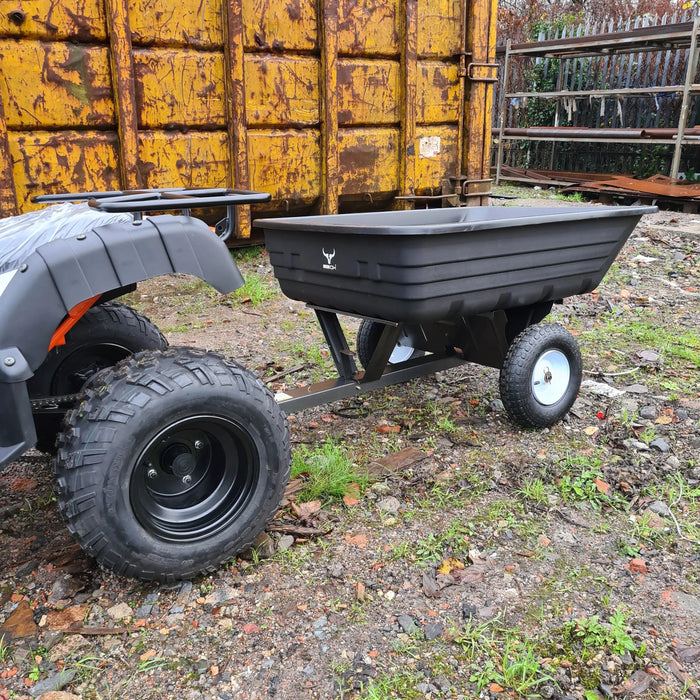 A small black Iron Ox® Haul 4 - Tipping Trailer 400lb with wheels.