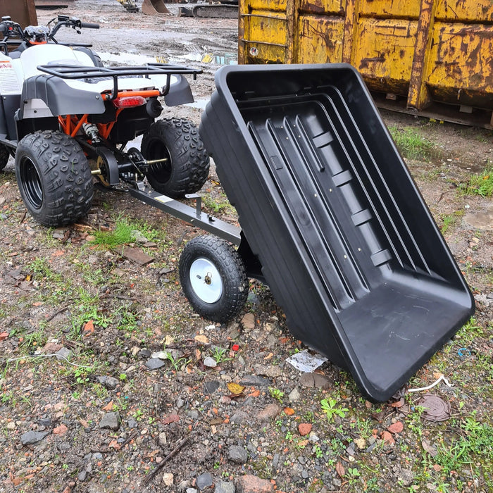 A black ATV with an Iron Ox® Haul 4 - Tipping Trailer 400lb attached to it.