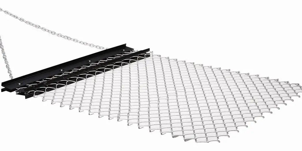 A black and white mesh hanging from a chain on a white background resembling a Light Duty Drag Harrow 4 Foot Wide *Free Delivery*.